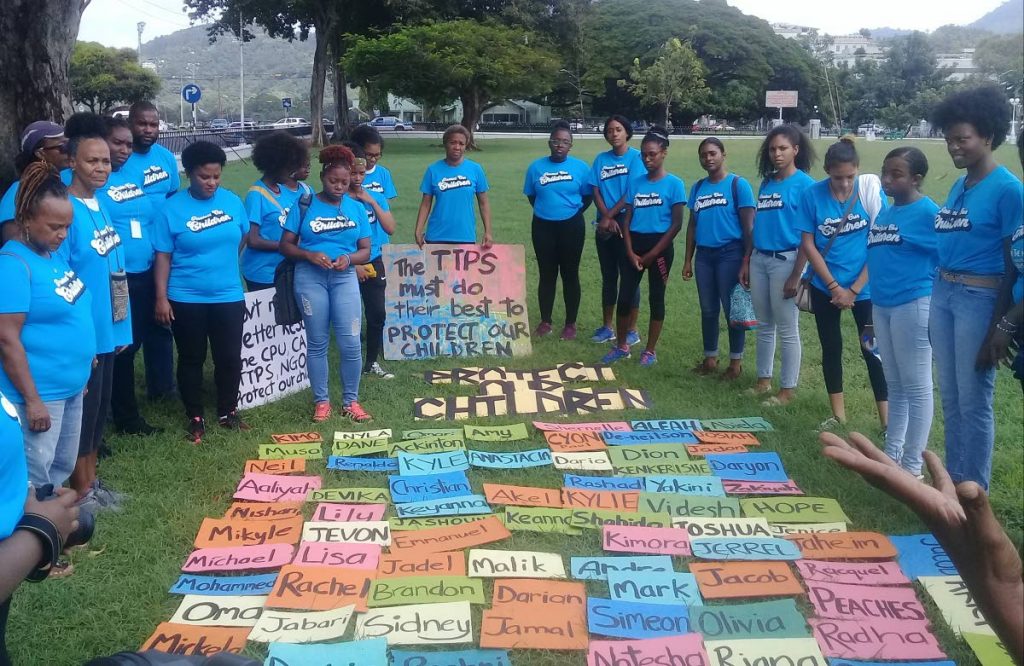 Members of Create Future Good made a circle around  some of the names of children who were killed from violent acts committed against them.  - Marlene Augustine