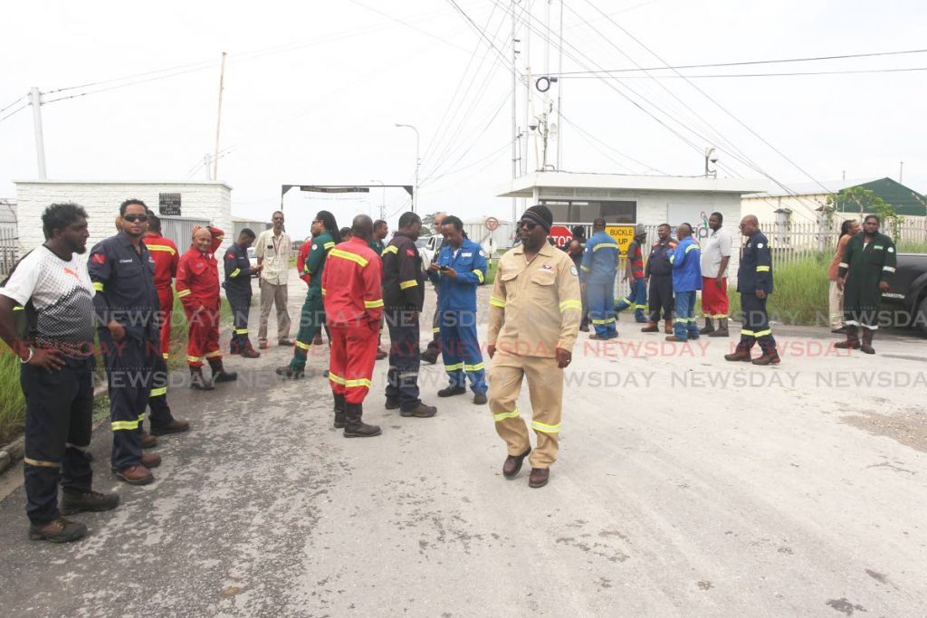 Contractors protest outside Paria Fuel Trading, Pointe-a-Pierre, after several safety concerns were raised.  - Lincoln Holder