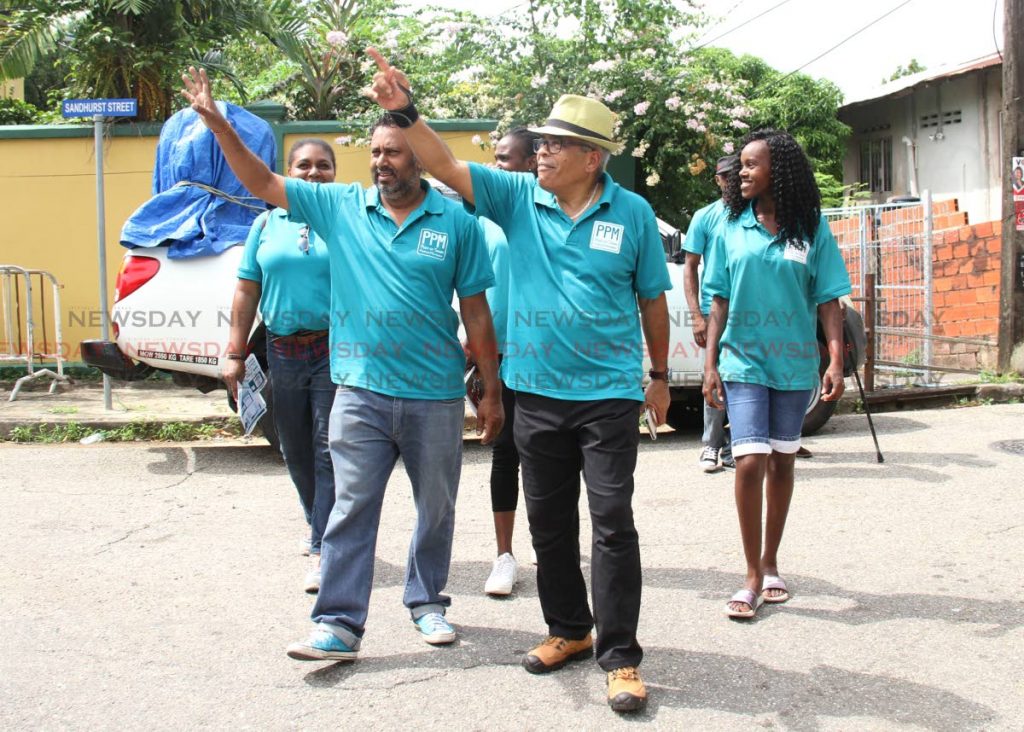 PPM leader Louis Lee Sing and supporters greet residents in Belmont on Saturday. - Ayanna Kinsale