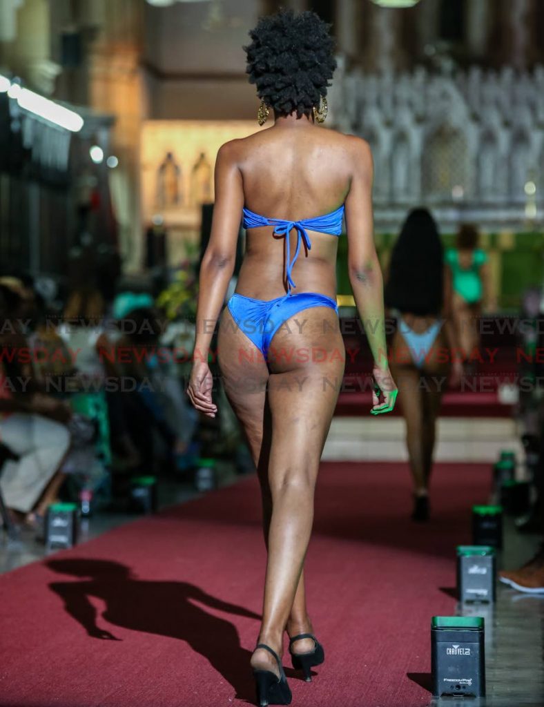 A model in a Genesis bikini walks on the red carpet of the Holy Trinity Cathedral, Port of Spain on November 4. - Jeff Mayers