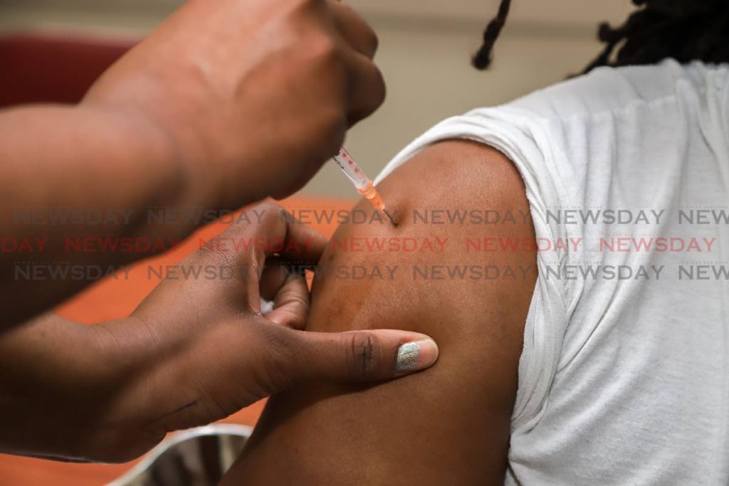 The H1N1 vaccine being administered.  - Keino Swamber
