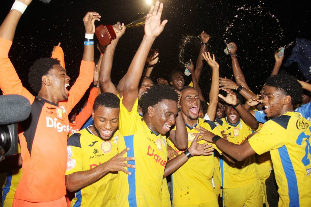 In this Nov 25 file photo, players of Presentation College San Fernando celebrate winning the Coca Cola South Zone Intercol title. Pres will play San Juan North in the final, on Wednesday. - Lincoln Holder