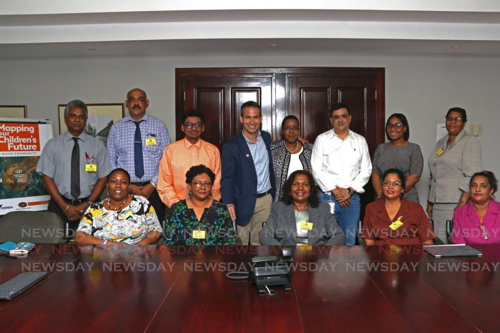 General Manager Guillermo Rojo De Diego (blue blazer), Human Resource Manager Group Cordinator Bonnie Alexis, Managing Director José Luis Seijo González and Group Legal/Secretary Michelle Davidson joins heads of primary schools at Trinidad Cement, Claxton Bay. - Marvin Hamilton