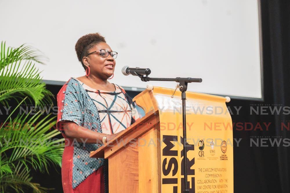  Dr Heather Cateau, senior lecturer and dean, Faculty of Humanities and Education, The UWI St Augustine, delivers greetings. - 