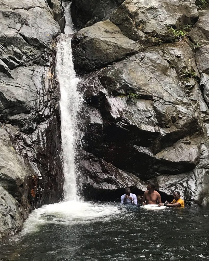 Barefoot Tobago hikers take a dip at Richmond waterfall.