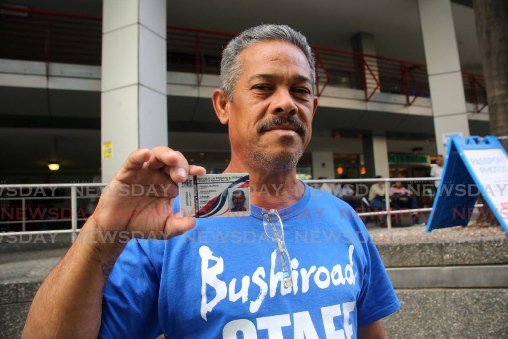 LUCKY JESUS: Venezuelan Rangel Garcia Leonel Jesus displays his government-issued permit which he collected yesterday at the Immigration Department in Port of Spain. PHOTO BY SUREASH CHOLAI - SUREASH CHOLAI