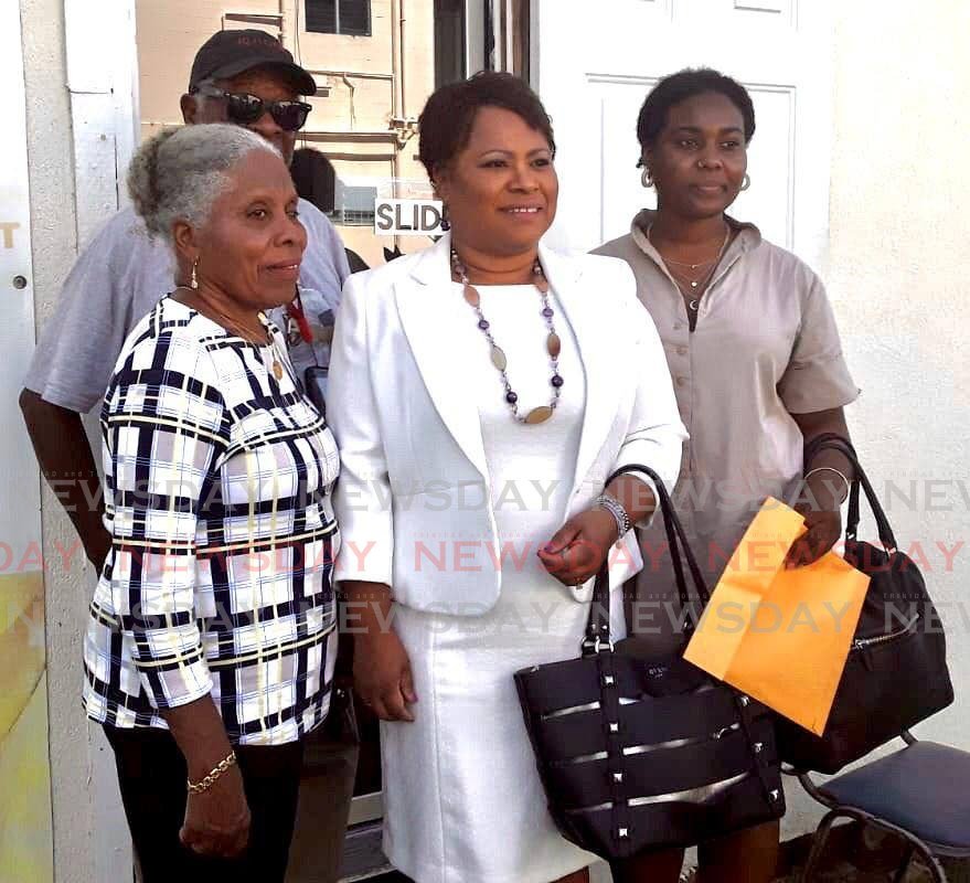 Dr Denise Tsoiafatt Angus, centre, smiles after filing her nomination papers at the PNM headquarters in Scarborough on Monday to contest the leadership of the PNM Tobago Council. PHOTO BY ELIZABETH GONZALES - ELIZABETH GONZALES