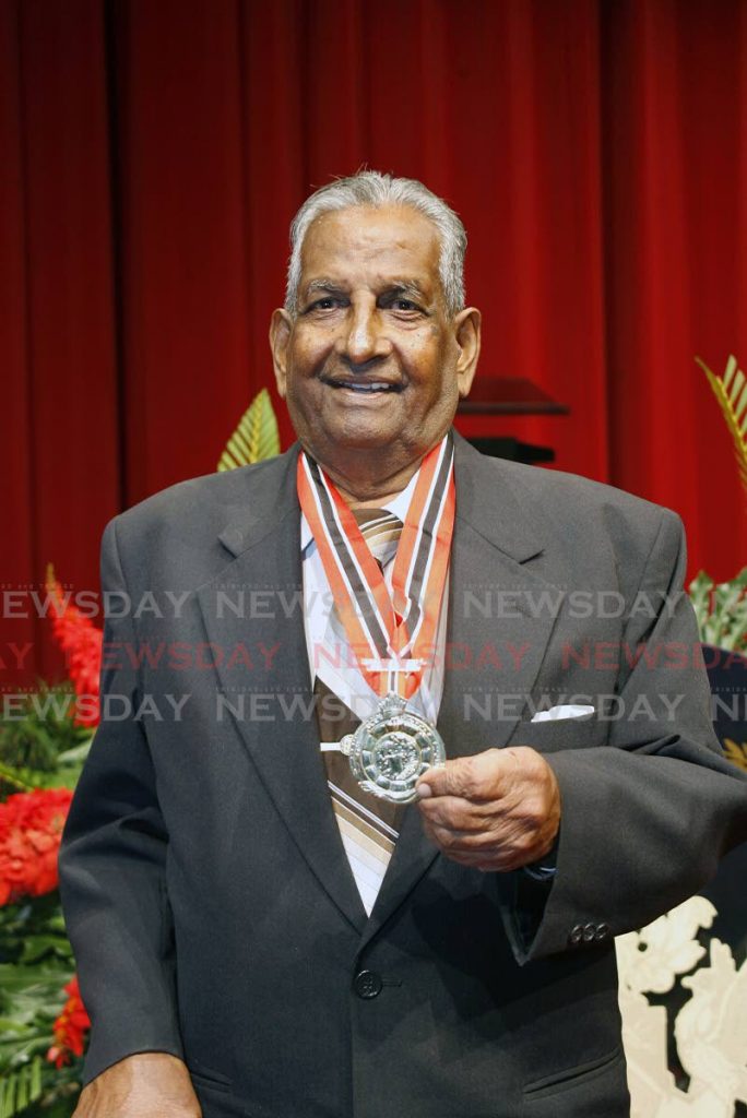 Kamaluddin Mohammed celebrates receiving TT's highest national award, the Order of the Republic of TT, at NAPA, Port of Spain in 2010. Mohammed died in 2015 at age 88. - File Photo