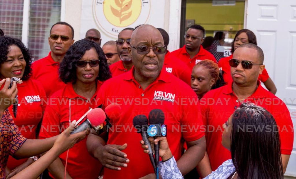 PNM Tobago Council political leader Kelvin Charles, centre, supported by his wife Catherine and Assembly members, Marslyn Melville-Jack and Kwesi Des Vignes, speaks to the media after filing his nomination papers for the January 2020 internal elections in Scarborough on Monday. PHOTO BY DAVID REID  - DAVID REID 