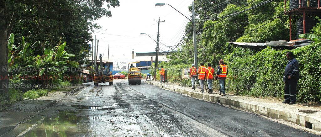 Carib Asphalt pavers conducting road rehabilitation works along the southern main road Otaheite which caused traffic delays. Photo by Lincoln Holder.