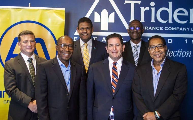 Ansa McAl (Barbados) Ltd chairman Andrew Sabga, front, second from right, and Trident Insurance president and CEO Algernon 