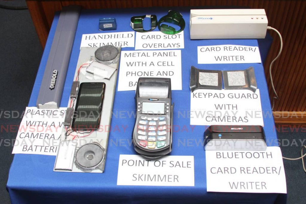 Some of the items seized from people committing ABM fraud on display at the Police Service's weekly press briefing on Wednesday.  PHOTO BY JEFF K MAYERS - Jeff Mayers