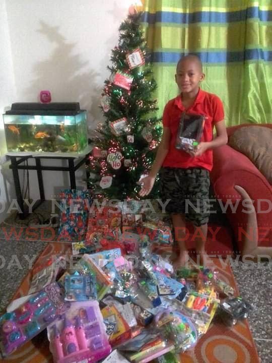Jaylon Best with some of the gifts he collected for a previous toy drive. Photo courtesy Janelle Best - 