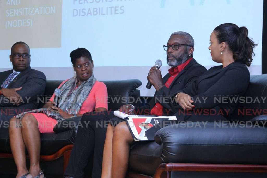 Glen Niles of Down Syndrome Family Network, speaks during panel discussion, alongside Senator Paul Richards, Attorney at Law Ria Davidson and Nicole Cowie Mental Health & Disability Activist, the symposium on the discussion on the national policy for persons with disabilities, hosted by NODES - UWI Network and Outreach for Disability Education and Sensitization,
Centre for Language Learning, UWI St Augustine Campus. Photo by  - ROGER JACOB