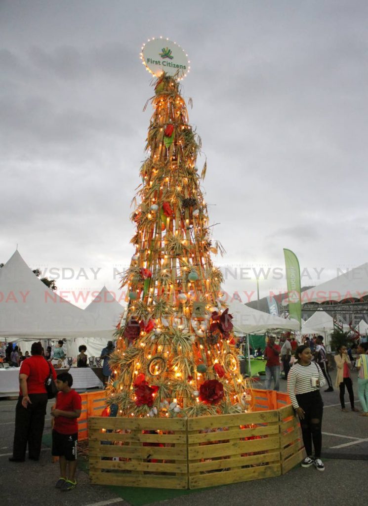 A bamboo Christmas tree made by Guyanese artist Andrew Waldron is a centre of attraction at the Christmas village, Queen's Park Savannah, Port of Spain. - ANGELO_MARCELLE