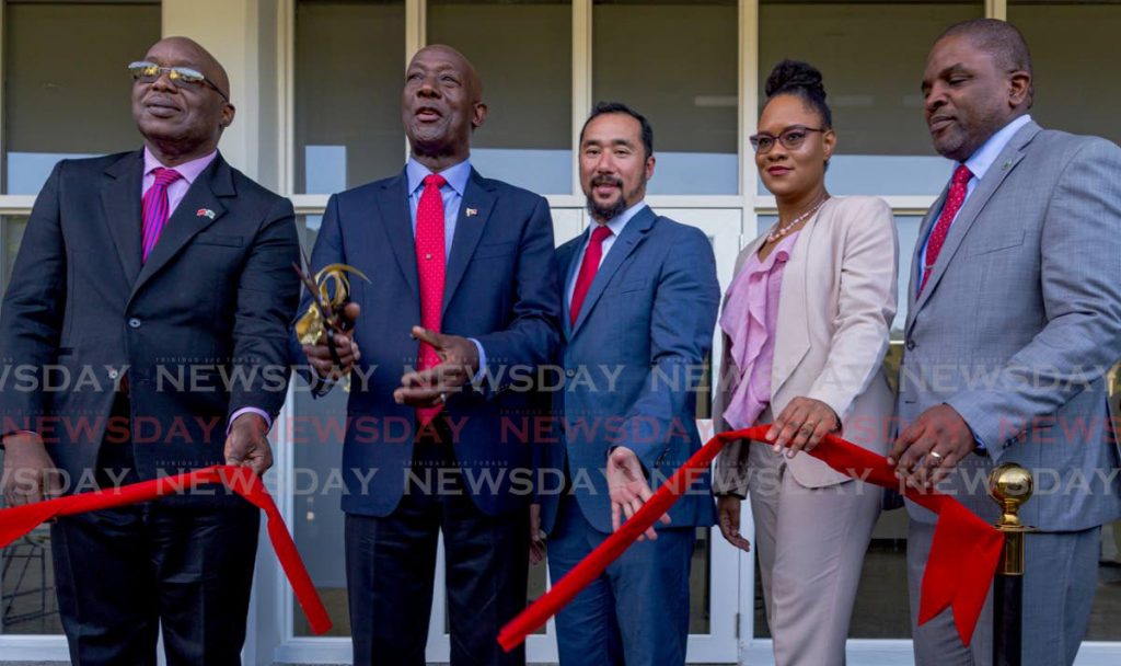 Prime Minister Dr Keith Rowley, second from left, cuts the ribbon to officially open the Roxborough Police Station on Friday. Joining him are (from left) Chief Secretary Kelvin Charles, National Security Minister Stuart Young, Tobago East MP Ayanna Webster-Roy and Deputy Chief Secretary Joel Jack.  - DAVID REID 