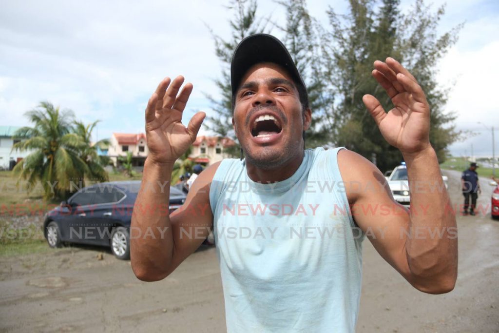 Venezuelan construction worker Richard Rosales complains bitterly about not being paid on the site of an HDC development in Corinth, San Fernando on Saturday. - Marvin Hamilton