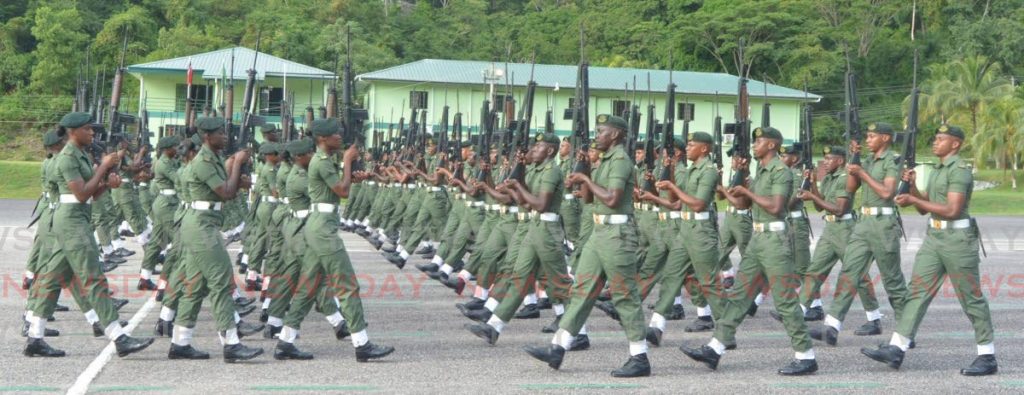 NEW RECRUITS: TT Regiment recruits of Intake 1901 perform a precision drill at the passing out parade on Saturday.
  - 