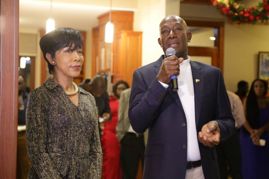 Prime Minister Dr Keith Rowley, right, speaks to his guests as his wife Sharon stands closely during the opening of the new PM residence on Saturday.  Photo via - THA 