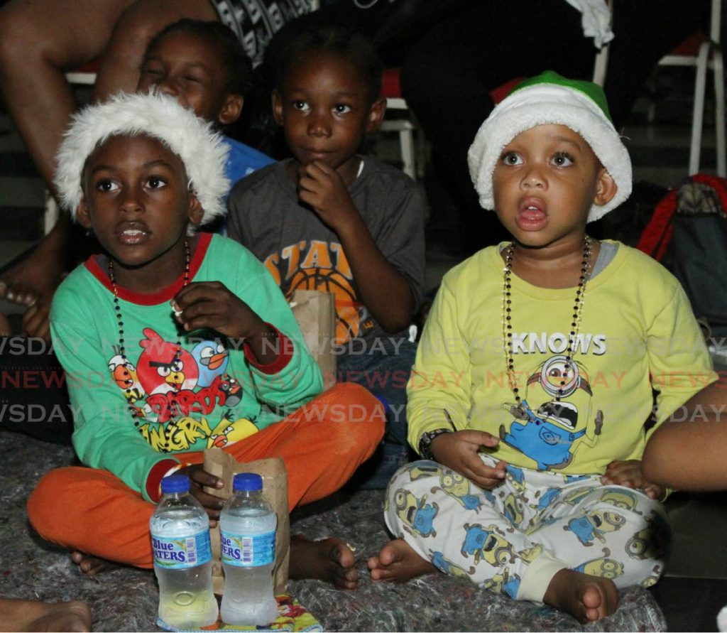 These two came out dressed in their Santa hats. - Angelo Marcelle