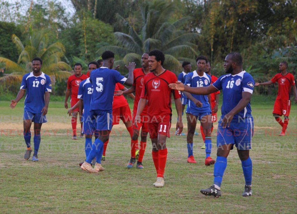 Bethel United(in blue) players complain after losing to Matura Reunited, in the TT Super League match, at the Matura Recreation Ground, on Saturday. - Roger Jacob