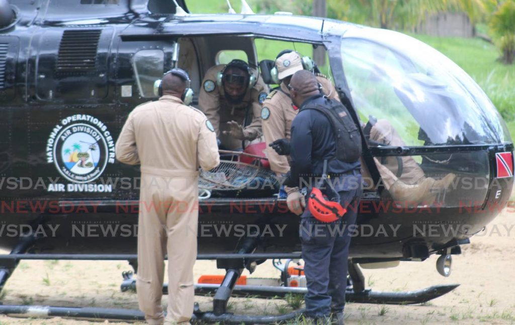 In this August 22, 2017 file photo a rescue team of the National Operations Centre air division loads equipment onto a helicopter during a search for a hiker. The air division was shut down on December 31. - 