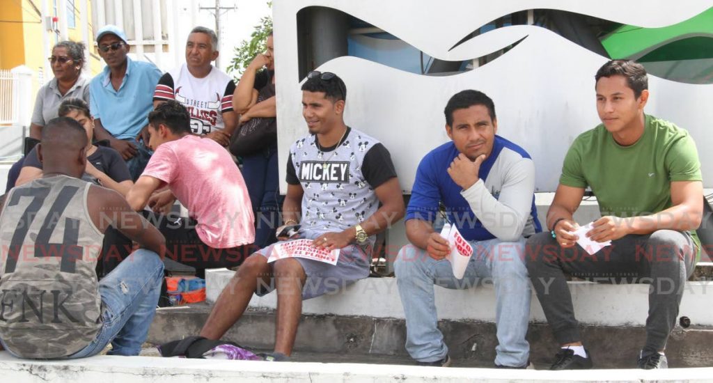 Venezuelans wait to be registered in San Fernando in June last year.
 - 