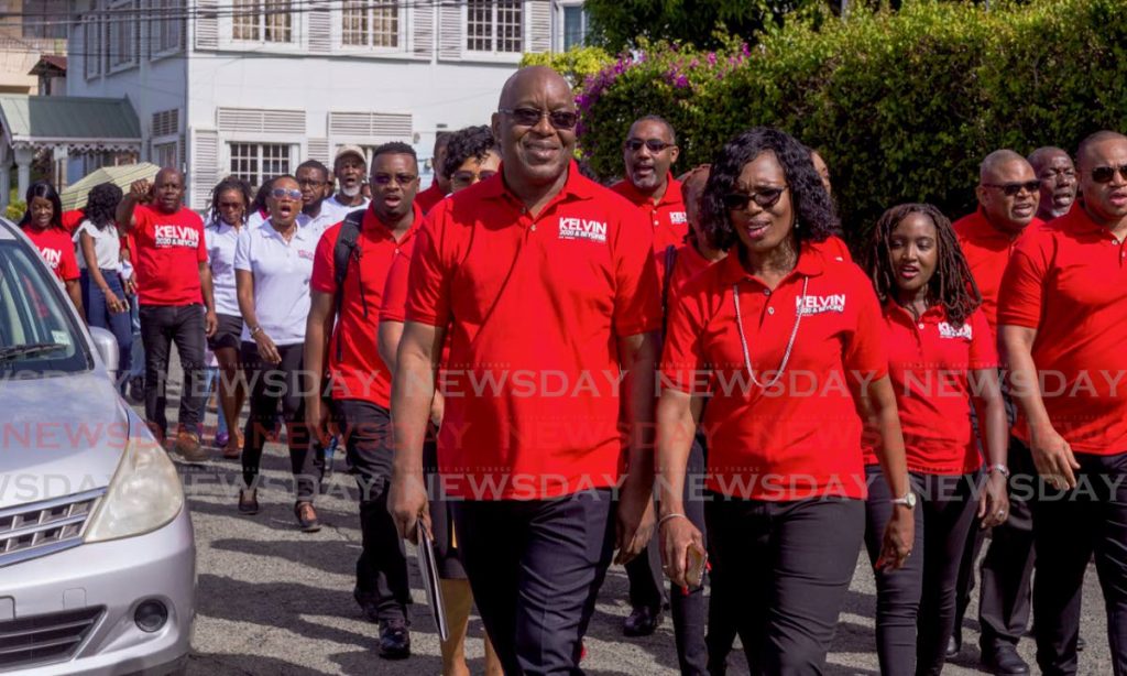 In this December 16 file photo, Chief Secretary and PNM Tobago Council political leader Kelvin Charle walks with his wife, Catherine, to the PNM headquarters in Scarborough to file his nomination papers to vie for another term as PNM leader in the January 19 internal elections. - DAVID REID 
