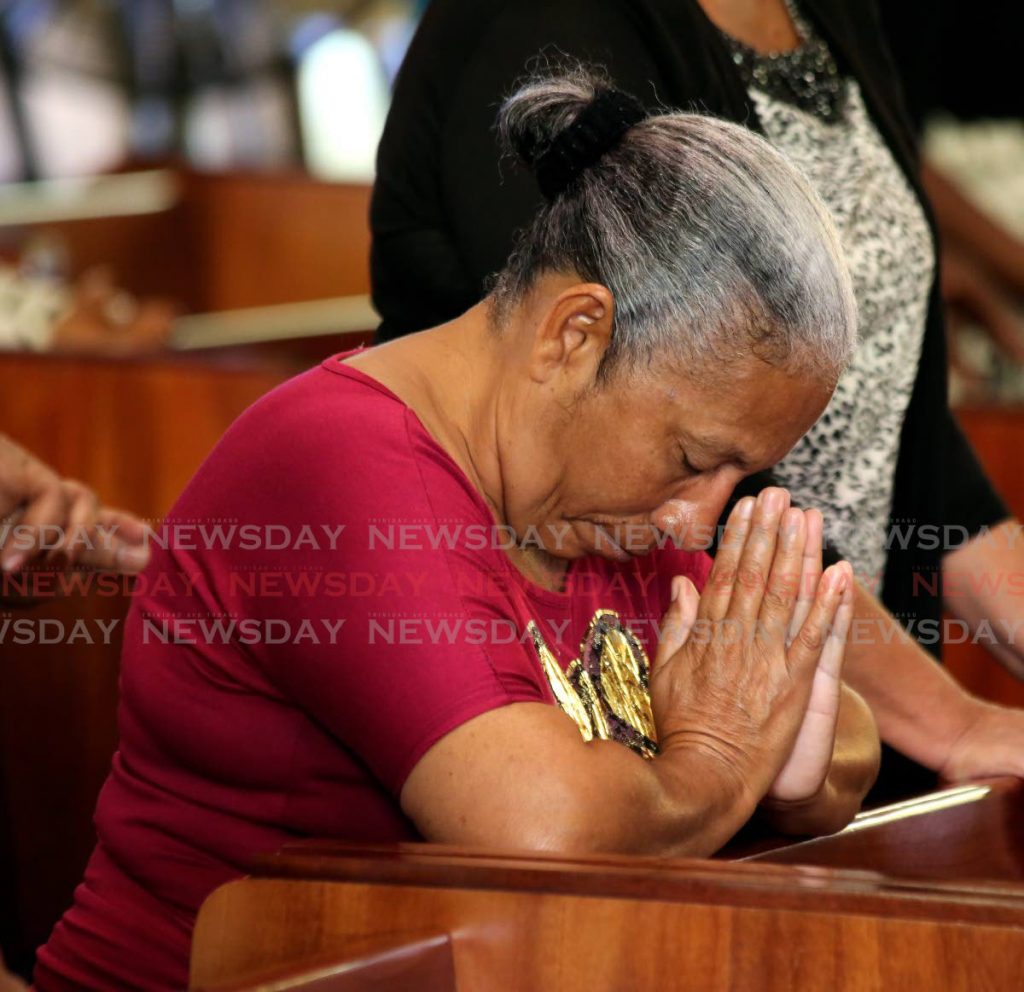 IN PRAYER: A woman prays at the New Year's morning mass at the Cathedral of the Immaculate Conception, Independence  Square, Port of Spain. PHOTO SUREASH CHOLAI - SUREASH CHOLAI