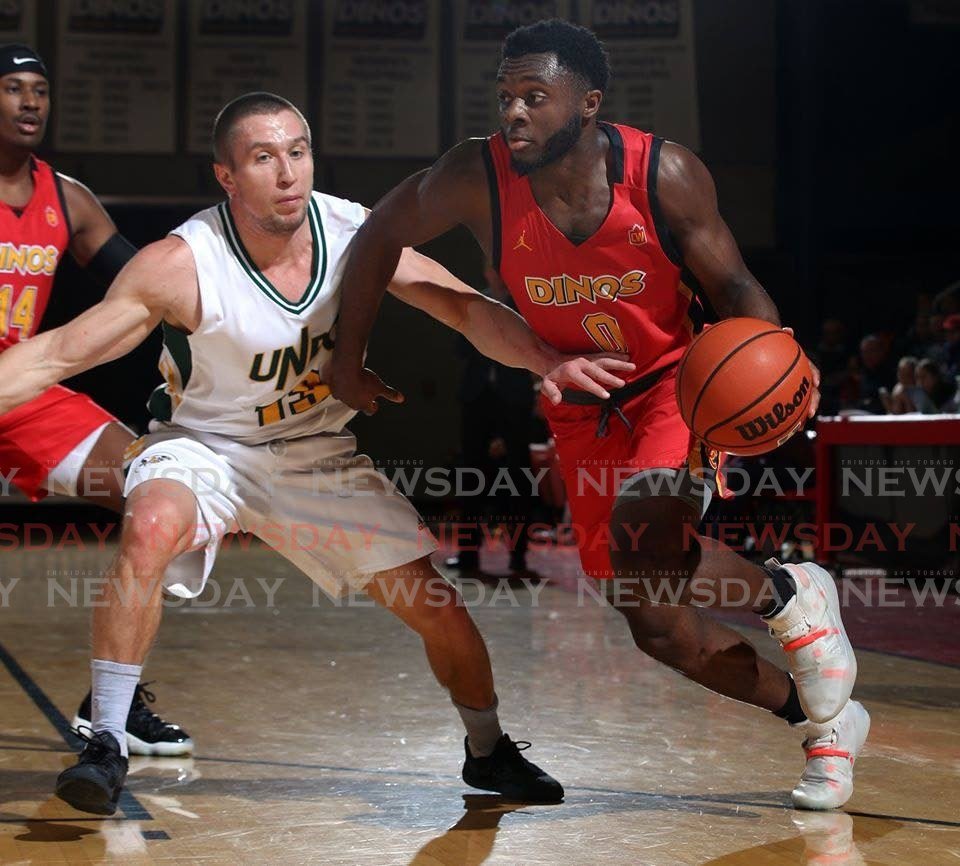 Trini basketballer Ezeoha Santiago, right, in action for University of Calgary Dinos in Canada. PHOTO COURTESY DAVID MOLL - 