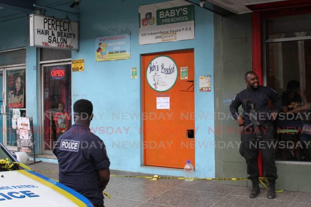 Police officers secure the Independence Square area, where Baby's Pre-school Principal Jezelle Philip was murdered. - Angelo Marcelle