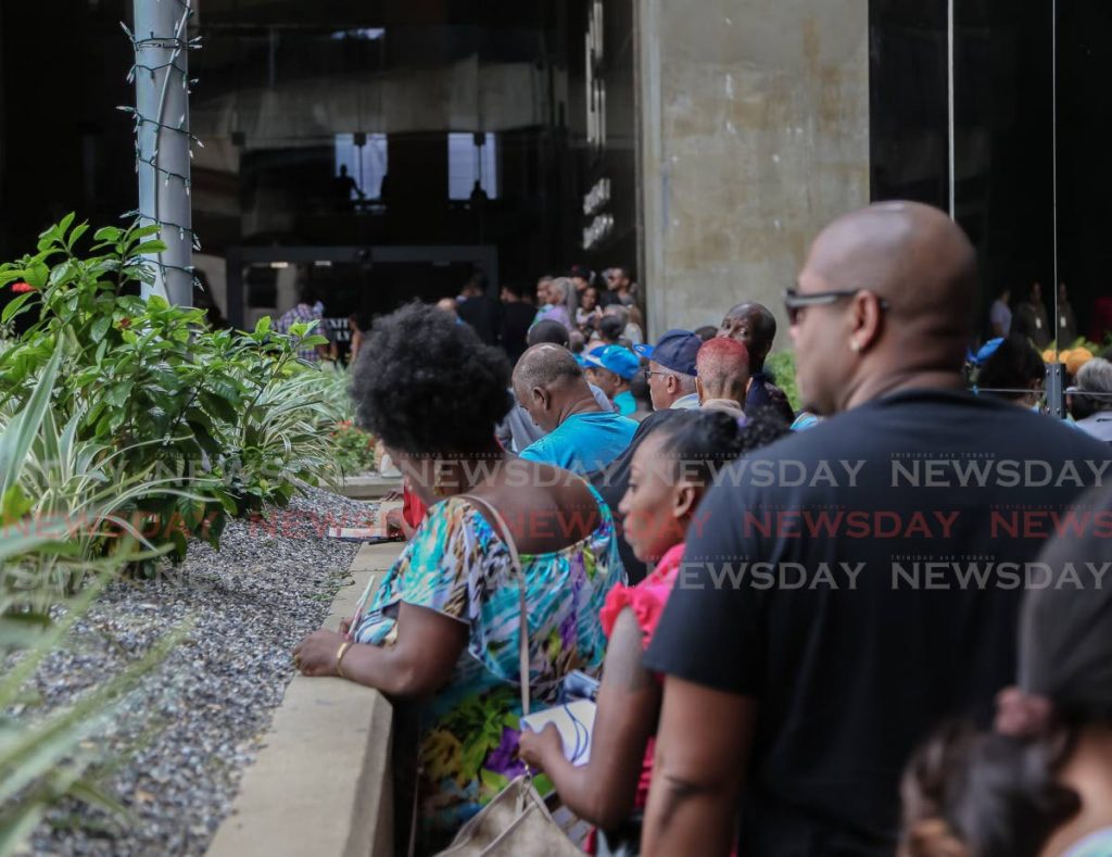 Long lines outside CBTT for  those who missed the December 31 2019 deadline to change the old 100 notes to polymer notes. - Jeff Mayers