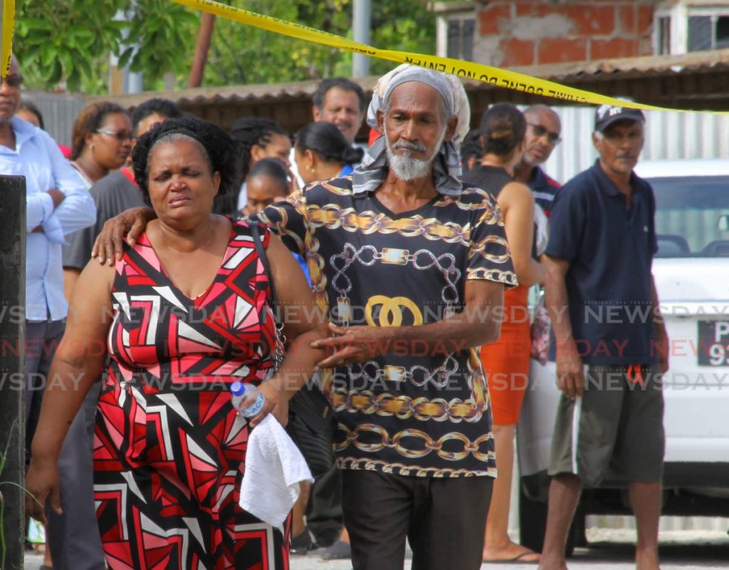 IN SHOCK: Paula Chunisingh, mother of murder victims Damian and Polly-Ann Chunisingh whose bodies were found along with their uncle’s, Randy Chunisingh, at their Pinto Road, Arima home on Monday.   - ROGER JACOB