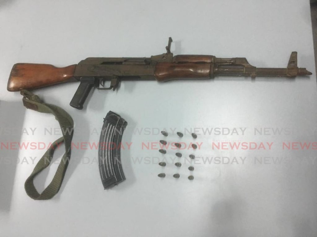 An assault rifle and 15 rounds of ammunition seized at a house in Sea Lots on Tuesday. 

photo courtesy TTPS - 