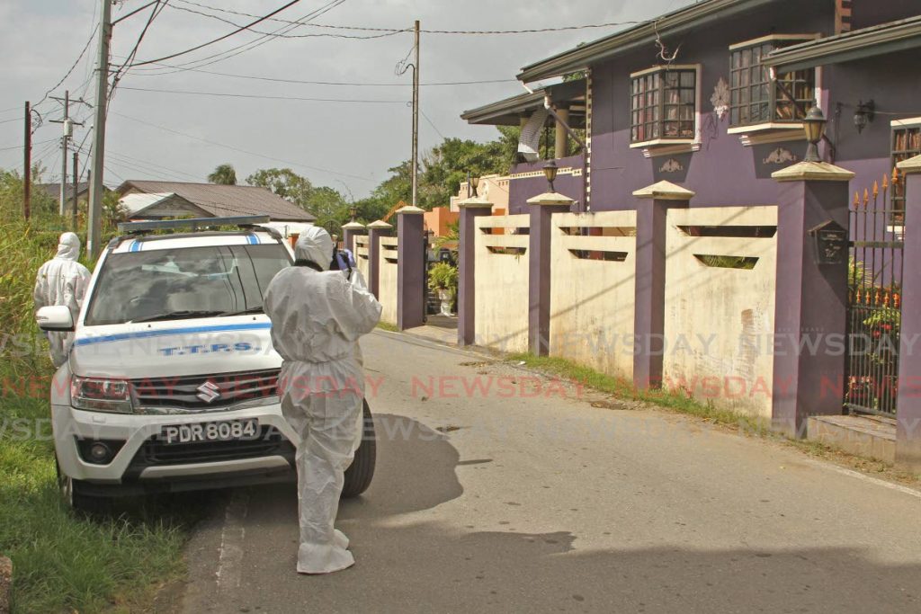 Crime scene investigators at  Jebodsingh Street, South Oropouch, home of Gabriella Du Barry, who was killed on Thursday morning. - Marvin Hamilton