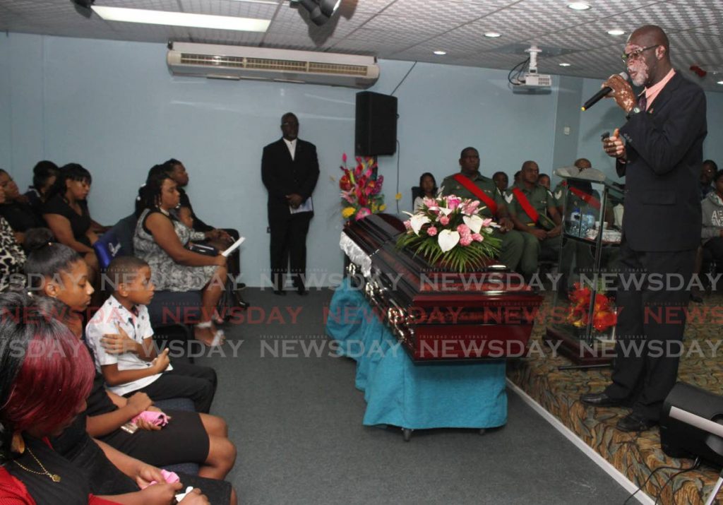 FOR MY WIFE: Lyndon Patterson sings at the funeral for his wife Lystra Hernandez-Patterson at the Covenant House of Praise, Henry Street, Port of Spain on Friday.  PHOTO BY ANGELO M MARCELLE - ANGELO_MARCELLE