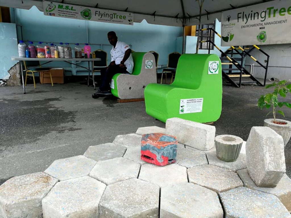 Benches, plant pots and pavers made from recycled plastics on display at a Flying Tree Environmental Management booth during a 2019 environmental event.  - 