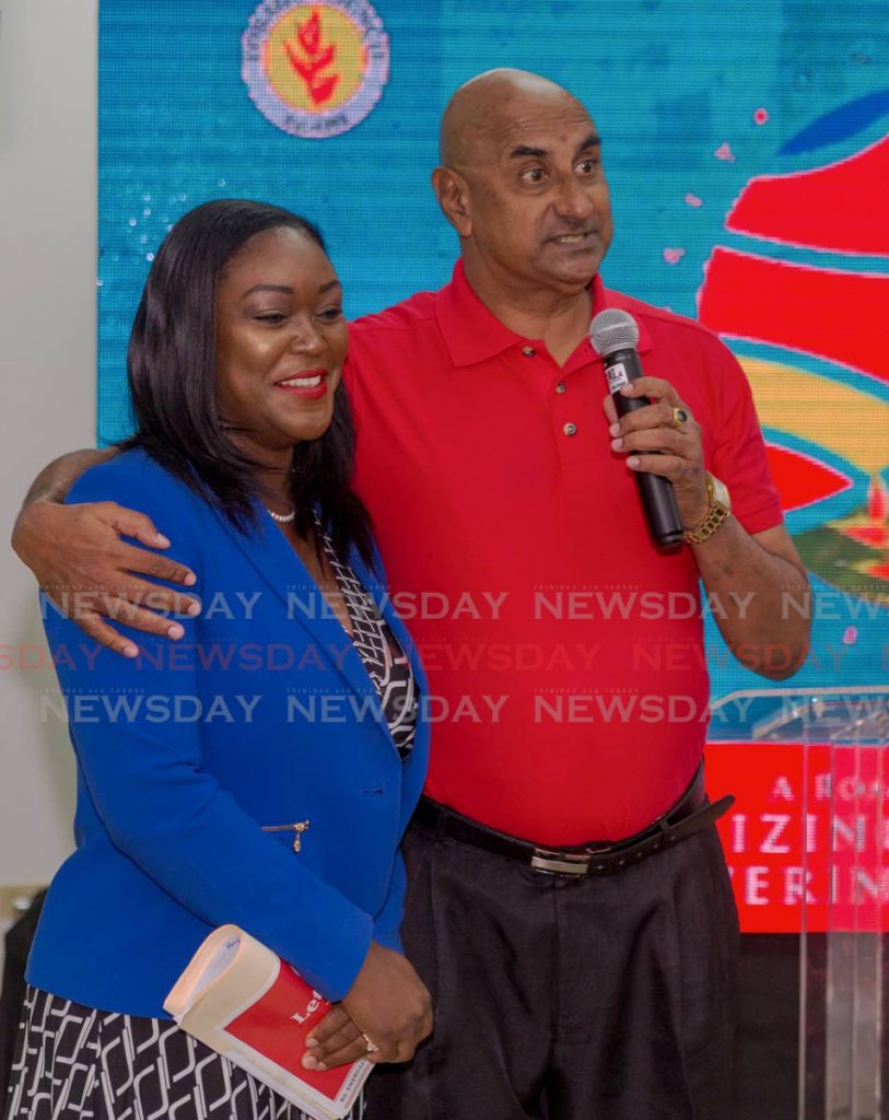 New PNM Tobago Council leader Tracy Davidson-Celestine is hugged by calypsonian Eric Powder after performing at her campaign launch recently at the Buccoo Integrated Facility. PHOTO BY DAVID REID  - DAVID REID 
