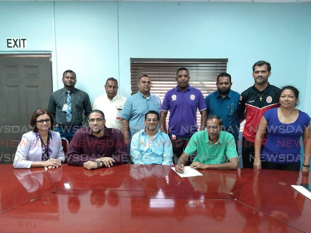 Officials of the Secondary Schools Cricket League and PowerGen renew their partnership. - 