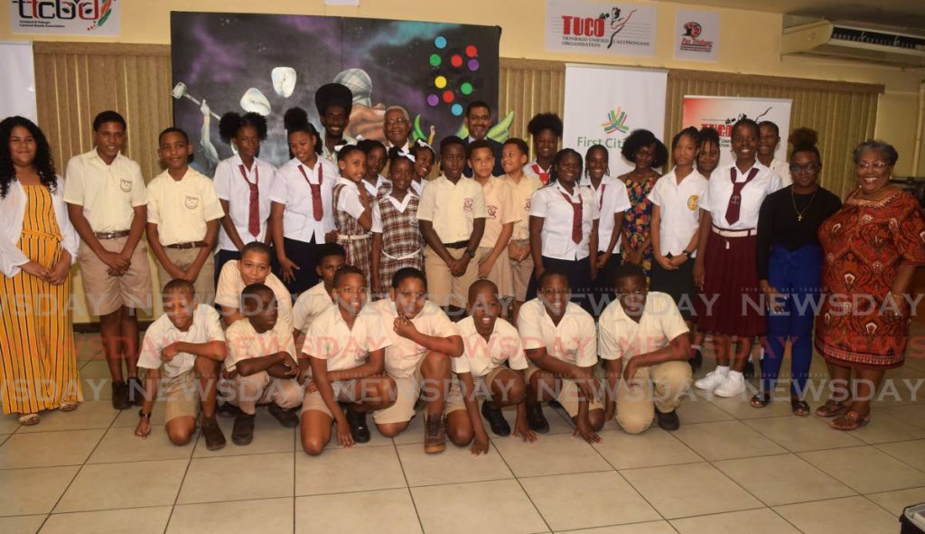 Junior Calypso Monarch hopefuls smile in a group photo with TUCO president Lutalo 
