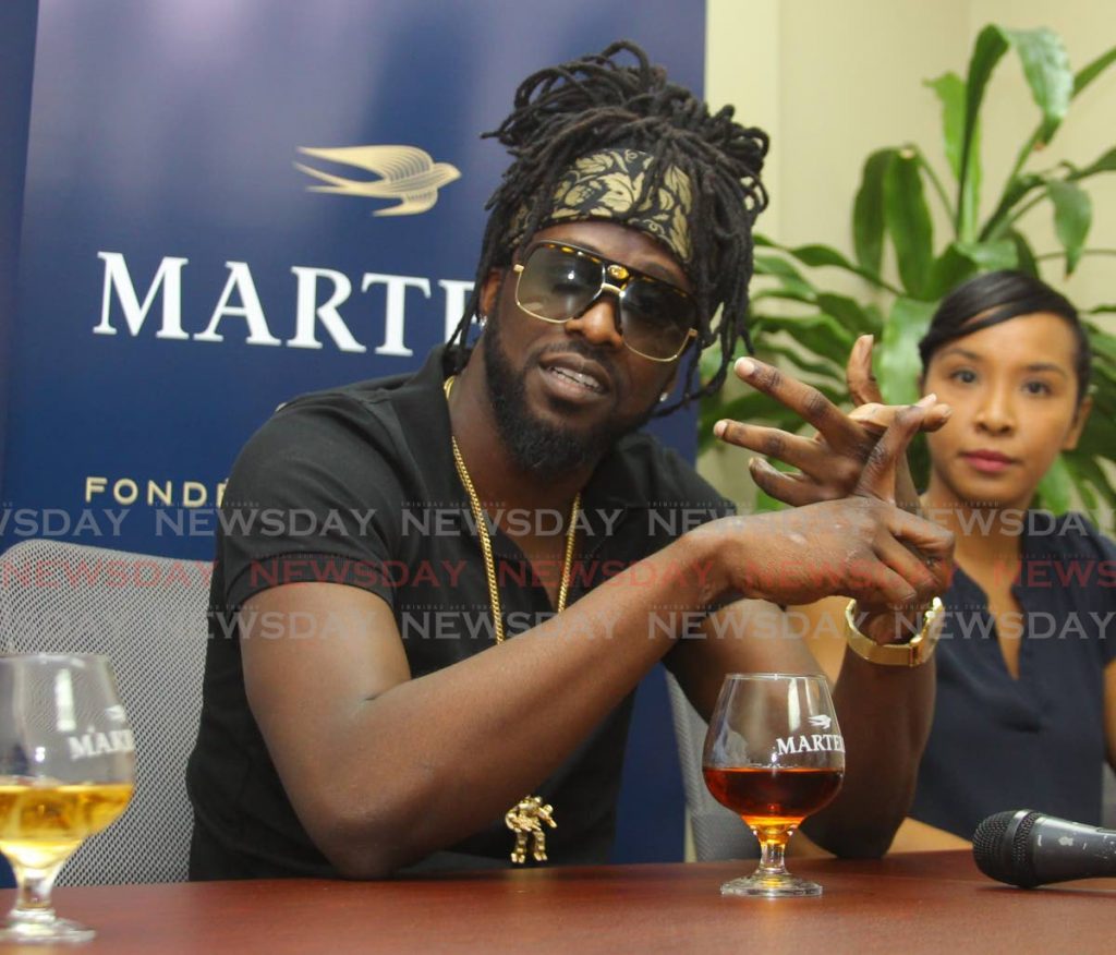   Gamal Doyle better known as Skinny Fabulous, at his official appointment as a brand ambassador for Martell Cognac wine,
for local distribution agent, MASSY Distribution, Macoya Industrial Estate, Macoya. Photo by  - ROGER JACOB