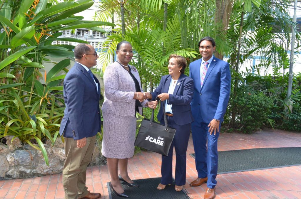 WELCOME: EMA chairman Nadra Nathai-Gyan greets Planning Minister Cherrie-Ann Crichlow-Cockburn, 2nd from left, at the EMA head office in St Clair last Thursday. At right is Ric Ali, Ag Deputy Permanent Secretary at the Planning Ministry while at left is EMA director Hayden Romano. PHOTO COURTESY EMA - EMA