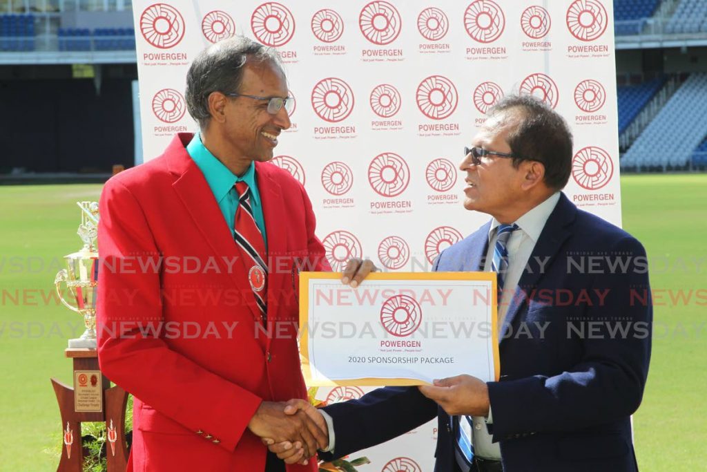 In this January 21, 2020 file photo, president of the Secondary Schools Cricket League Surujdath Mahabir, left, recieves the sponsorship package from general manager of PowerGen Surendra Ramsingh, at the opening of the 2020 season of the league at, at the Brian Lara Cricket Academy, Tarouba. Photo by Lincoln Holder