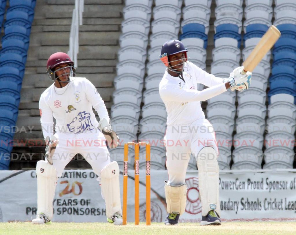 Justin Manick of Presentation College, Chaguanas smashes a six to bring up his fifty against Presentation College, San Fernando.  - Vashti Singh