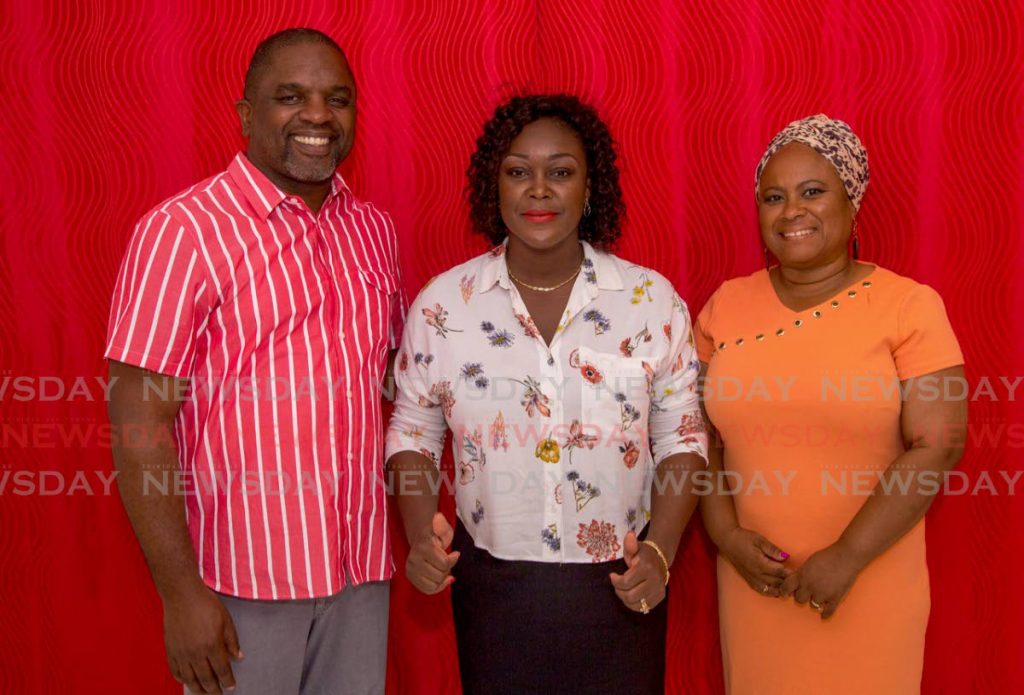 New political leader of the PNM Tobago Council, Tracy Davidson-Celestine, centre, shows thumbs up as she is flanked by defeated candidates Joel Jack, left, and Dr Denise Tsoiafatt Angus, who supported her in the runoff against incumbent Kelvin Charles on Sunday. PHOTO BY DAVID REID  - DAVID REID 