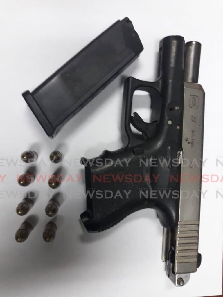 A pistol and eight rounds of ammunition seized from a Chaguanas man on Wednesday night.  - Shane Superville