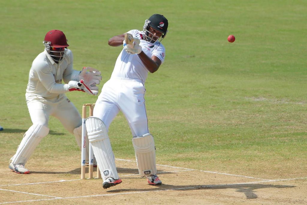 Jyd Goolie (right) in action for TT Red Force against the Leeward Islands Hurricanes during a recent match. - 