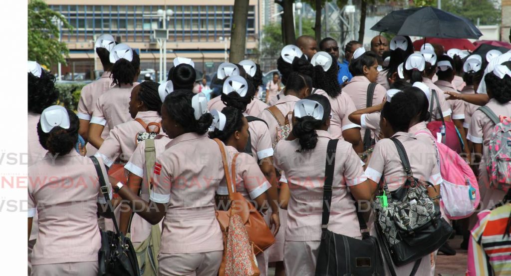 In a November 11, 2015 file photo student nurses protest in Port of Spain. On January 21, 2020, student nurses received the results of an exam they wrote in October 2019, president of the Appointees of the Nursing Council of TT David Murphy said on Saturday. - 