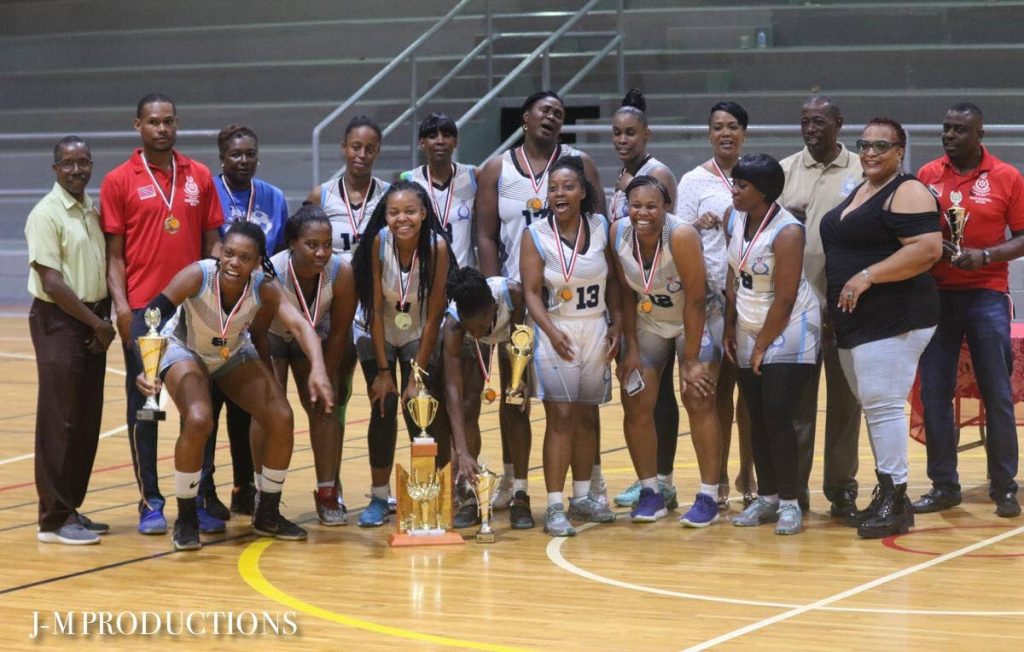 Members of the Police women's basketball team with their trophies and medals after winning the NIC Basketball Championships. Also in photo are Patrice Charles (left), director of Physical Education and Sport at the Ministry of Sport and Youth Affairs, and National Basketball Federation of TT (NBFTT) president Claire Mitchell (second from right). PHOTO COURTESY J-M PRODUCTIONS. - 