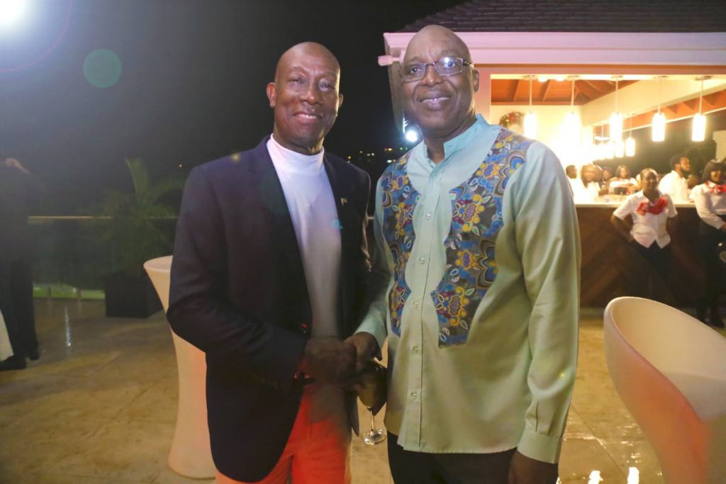 Prime Minister Dr Keith Rowley, left, greets Chief Secretary Kelvin Charles at the opening of the PM residence in Blenheim on December 21, 2019. PHOTO COURTESY Office of the Chief Secretary  - Office of the Chief Secretary 